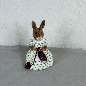 Brown Bunny Figurine in White Dress with Green Polka Dots and Maroon Accessory